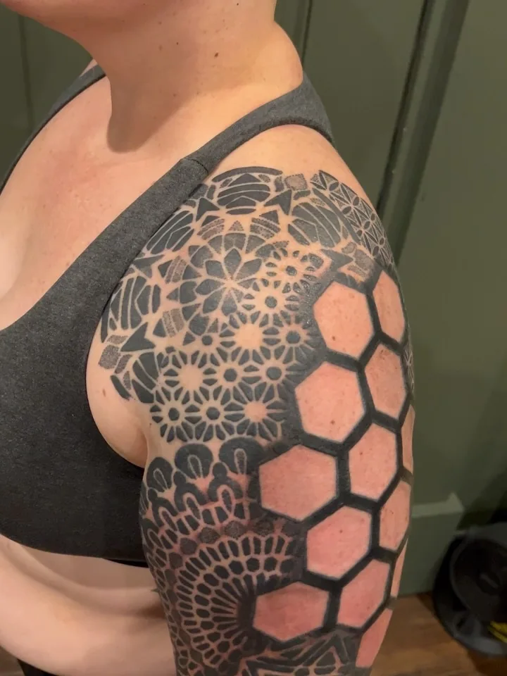 Intricate geometry tattoo sleeve from ZEITGEIST